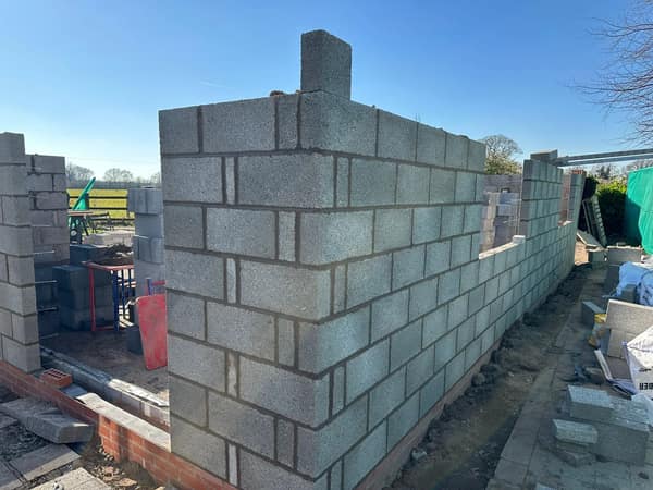 Garden wall with piers and stone coping
